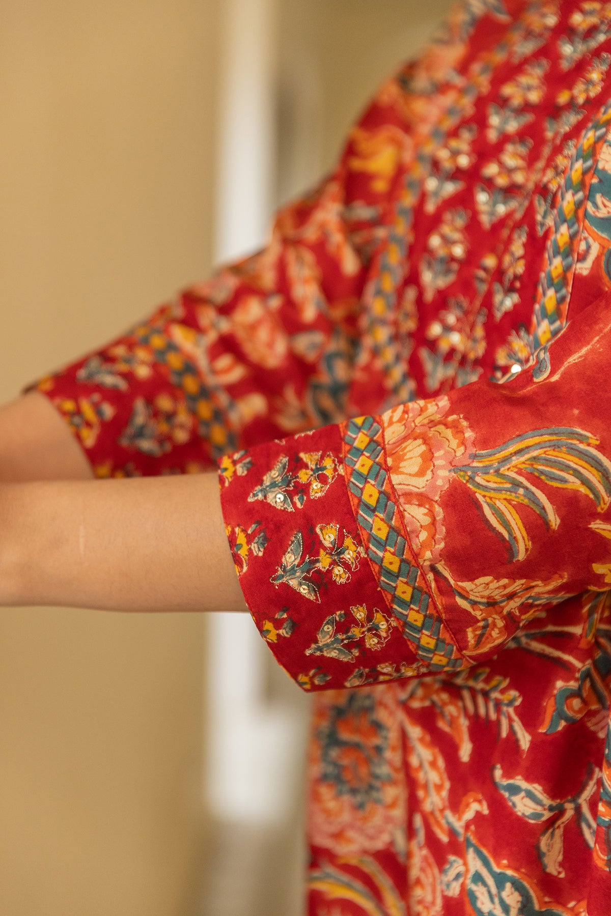 Festive Suit Set in Red Printed Muslin with Chanderi Patch Dupatta