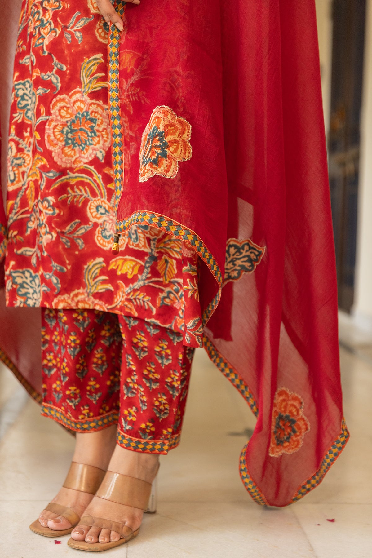 Festive Suit Set in Red Printed Muslin with Chanderi Patch Dupatta
